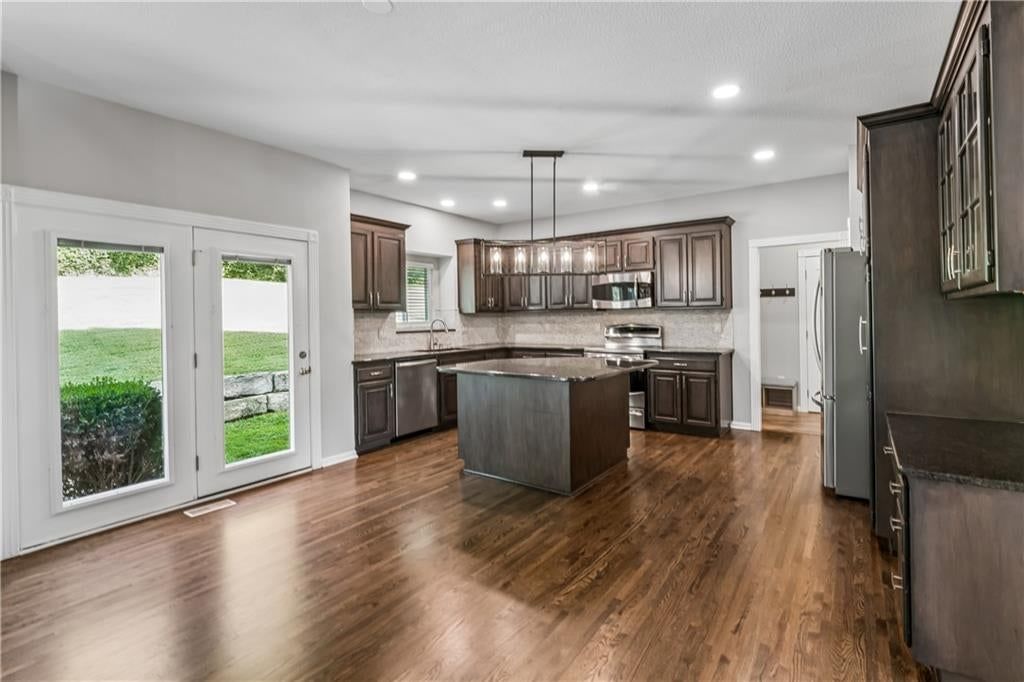 Kitchen island, updated kitchen and granite counters at 12178 S PRAIRIE CREEK Parkway, Olathe, KS 66062
