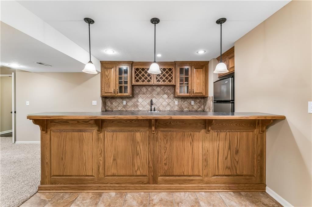 Covered patio, big backyard and flat lot at 12178 S PRAIRIE CREEK Parkway, Olathe, KS 66062