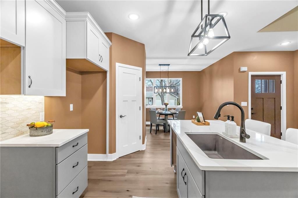 Kitchen island, kitchen island seating and walk-in pantry at 920 N 14th Street, Leavenworth, KS 66048