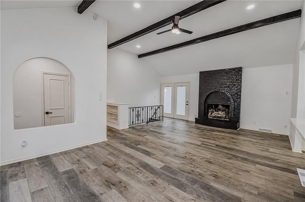 Open floor plan, tall ceilings and ceiling beams at 5210 S Mccoy Street, Independence, MO 64055