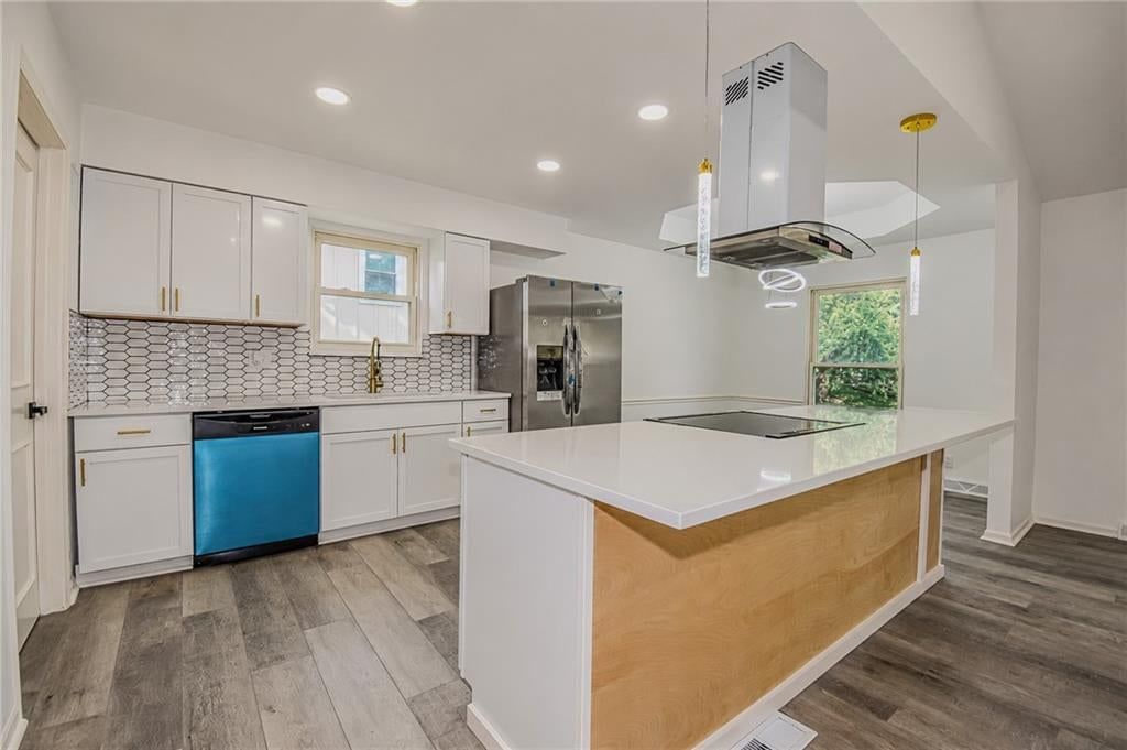 White kitchen, kitchen island and updated kitchen at 5210 S Mccoy Street, Independence, MO 64055