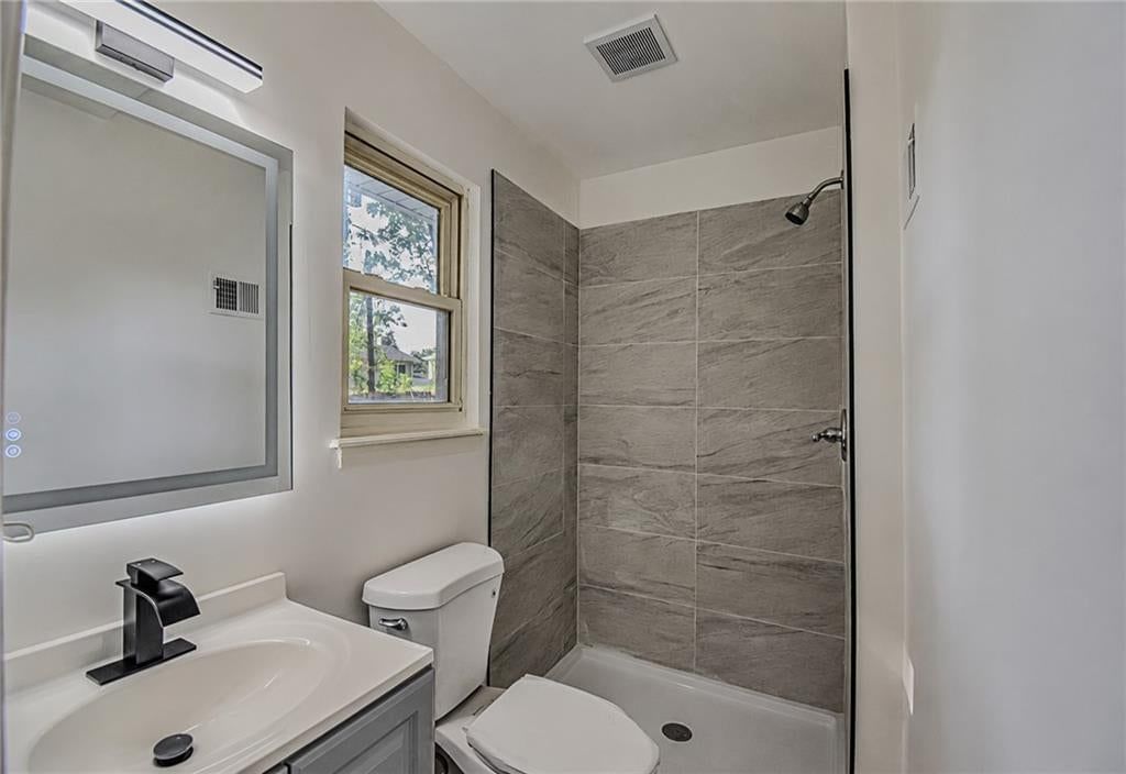 Frameless glass shower, tiled shower and walk-in shower at 5210 S Mccoy Street, Independence, MO 64055