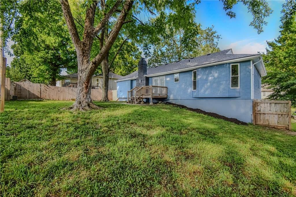 Mature trees, fenced yard and big backyard at 5210 S Mccoy Street, Independence, MO 64055