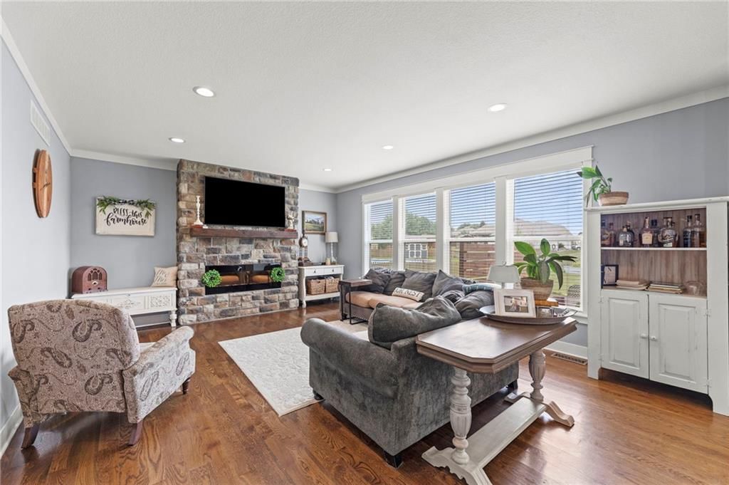 Fireplace and wainscoting or board and batten at 1800 Knoll Creek Lane, Raymore, MO 64083