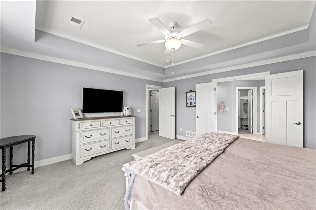 Walk-in shower and tiled shower at 1800 Knoll Creek Lane, Raymore, MO 64083