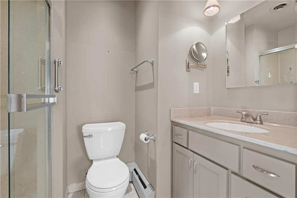 Walk-in shower and frameless glass shower at 1506 SW 6th Street, Lee's Summit, MO 64081