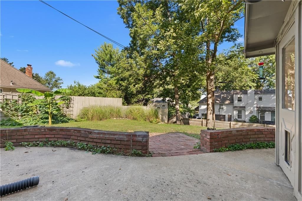 Big backyard, fenced yard and paver patio at 1506 SW 6th Street, Lee's Summit, MO 64081