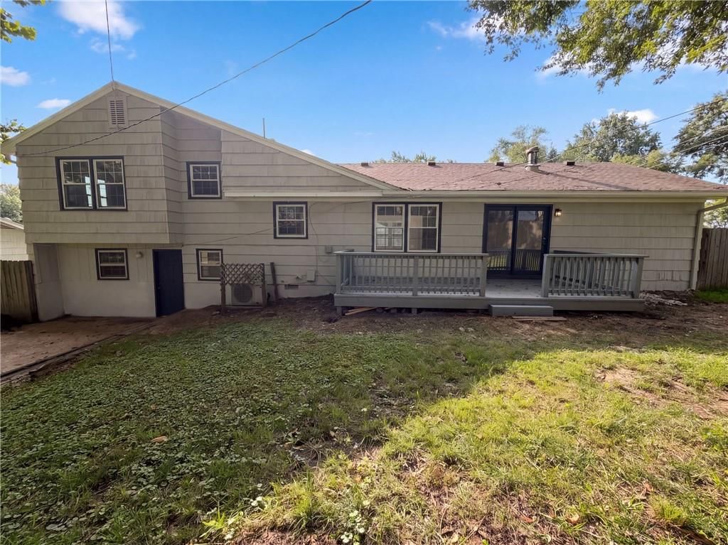 Deck, big backyard and fenced yard at 12904 E 54th Street, Kansas City, MO 64133
