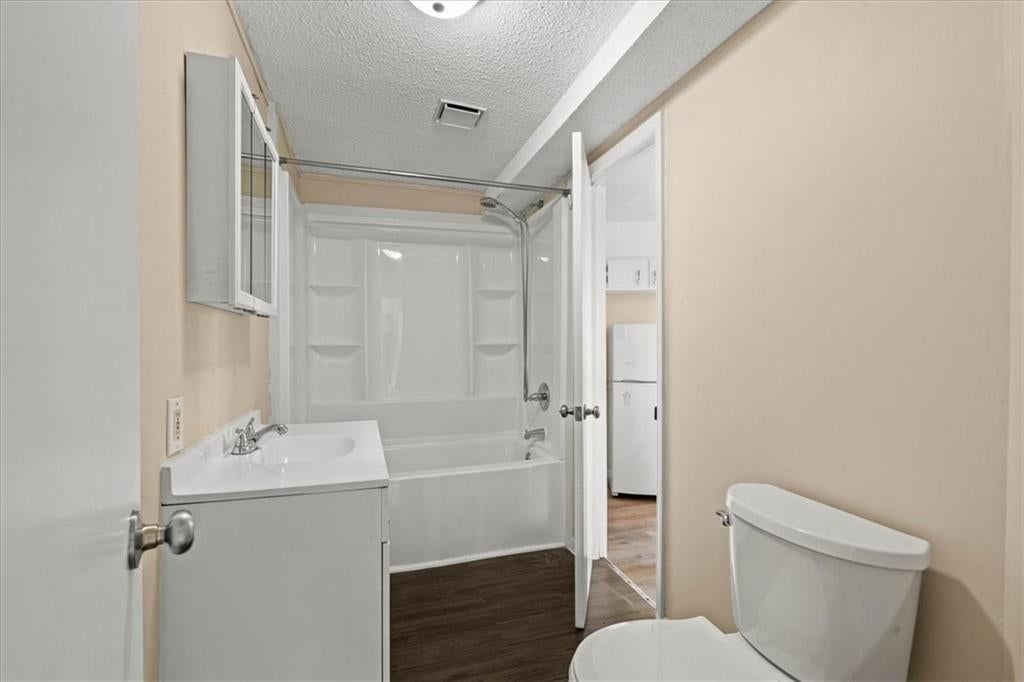 Tiled shower and renovated bathrooms at 4011 - 4013 N Jackson Avenue, Kansas City, MO 64117