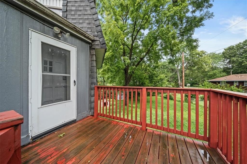 Covered front porch, deck and covered patio at 4011 - 4013 N Jackson Avenue, Kansas City, MO 64117