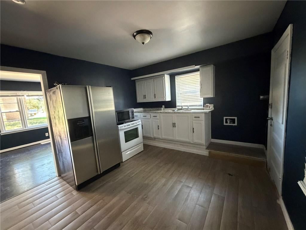White kitchen cabinets at 1003-1005 W College Street, Independence, MO 64050