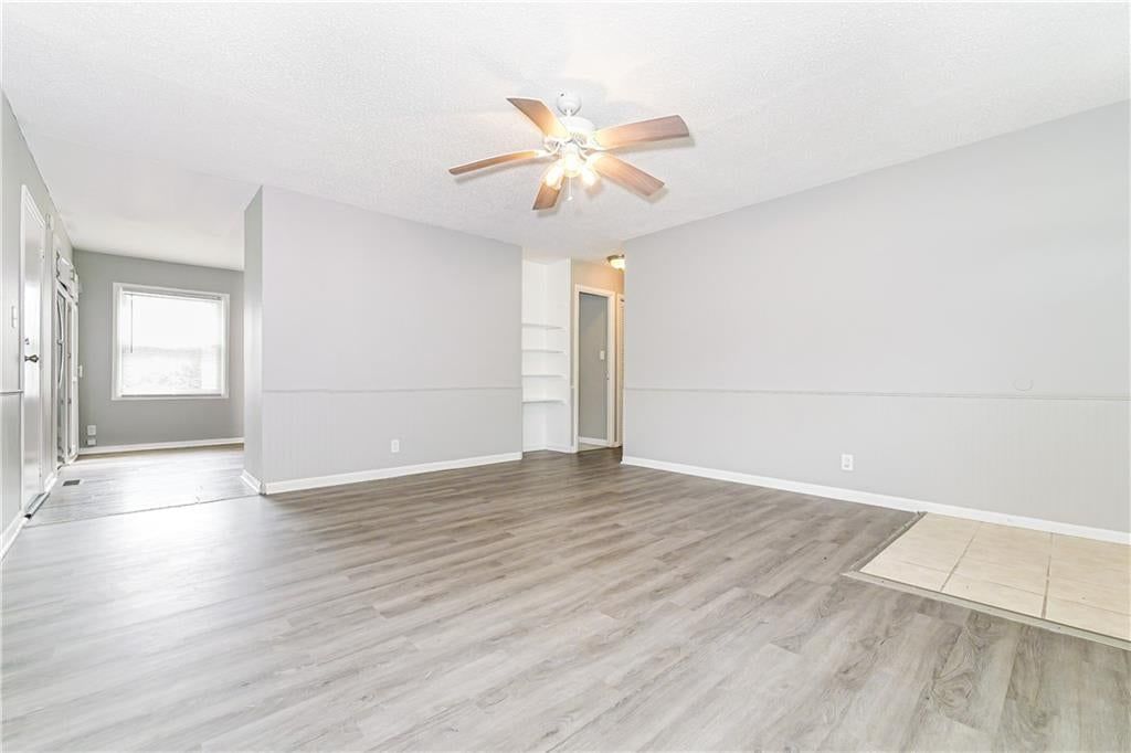 Wainscoting or board and batten and wall of windows at 807 N Ponca Drive, Independence, MO 64056