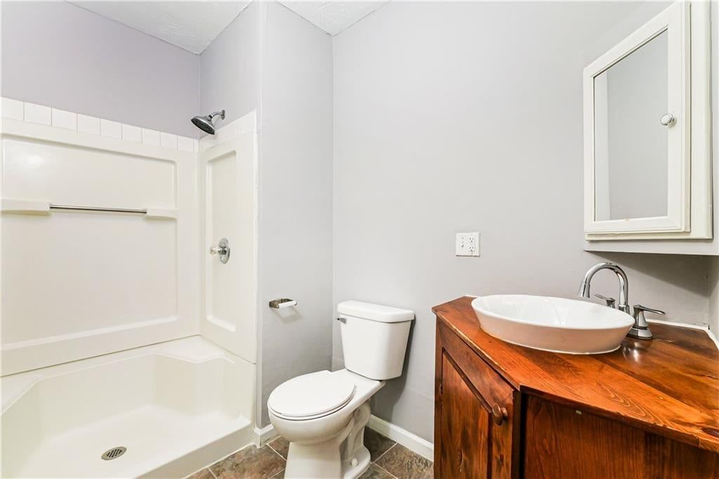 Wood vanity at 807 N Ponca Drive, Independence, MO 64056