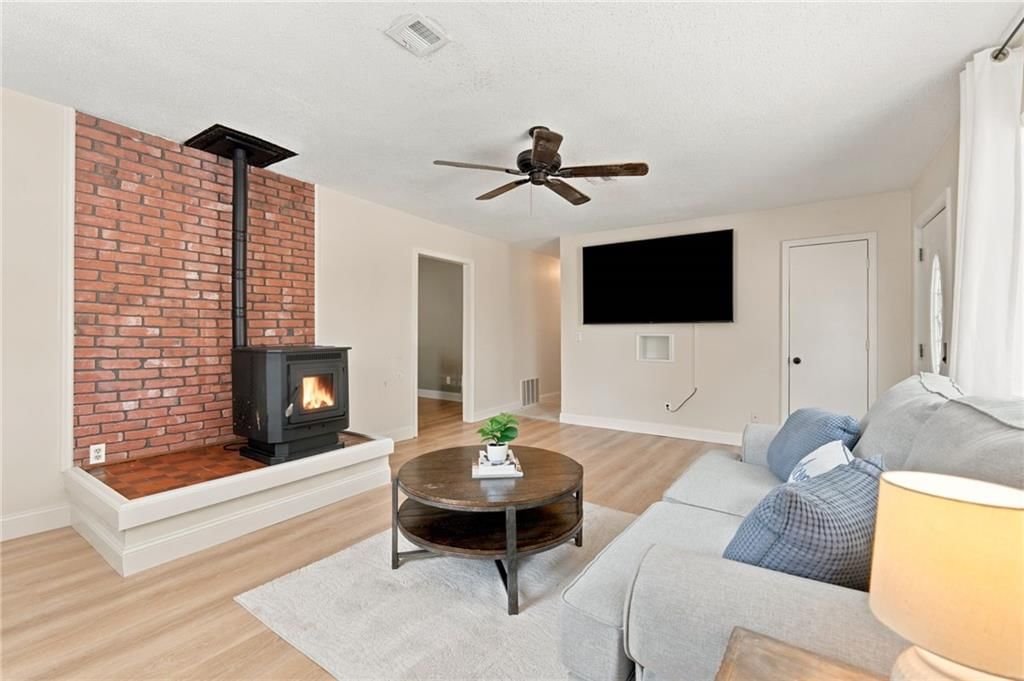 Fireplace, exposed brick wall and brick fireplace at 209 Main Street, Bucyrus, KS 66013