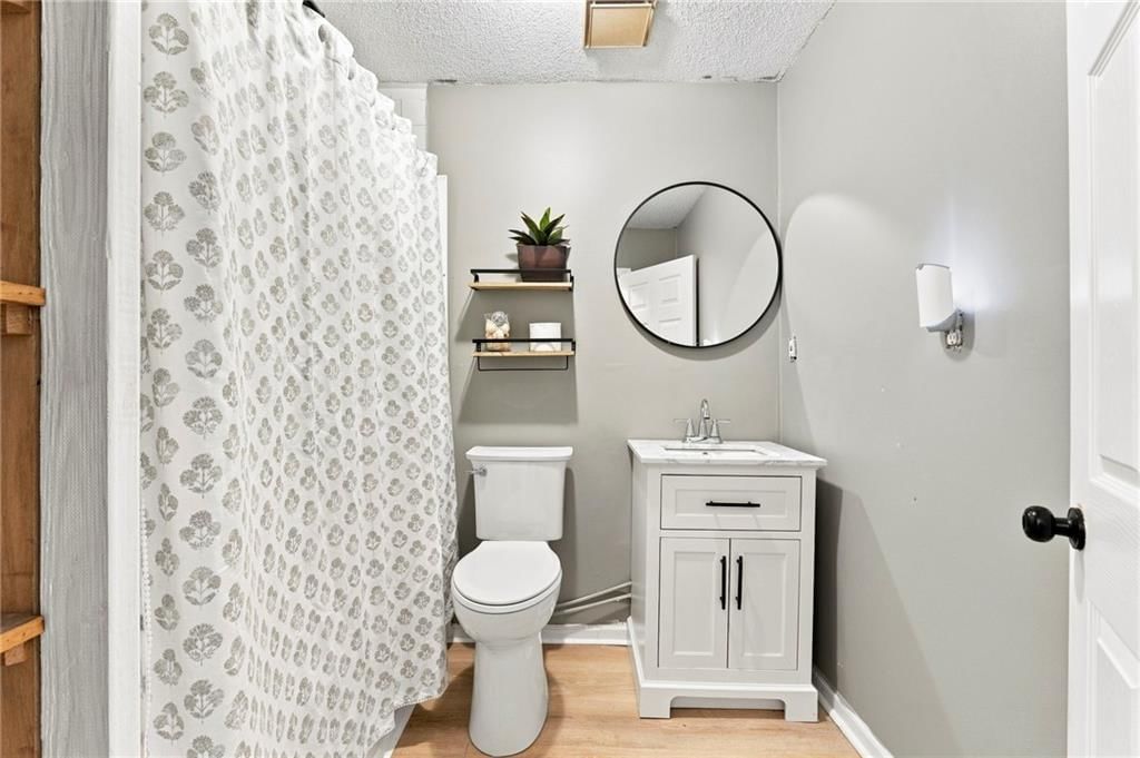 Tiled shower and black hardware at 209 Main Street, Bucyrus, KS 66013