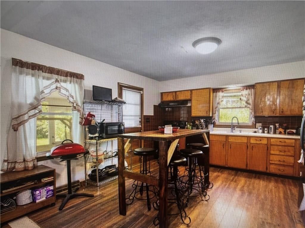 Breakfast nook, wood kitchen cabinets and raised-panel cabinets at 9723 E 13th Street S, Independence, MO 64052