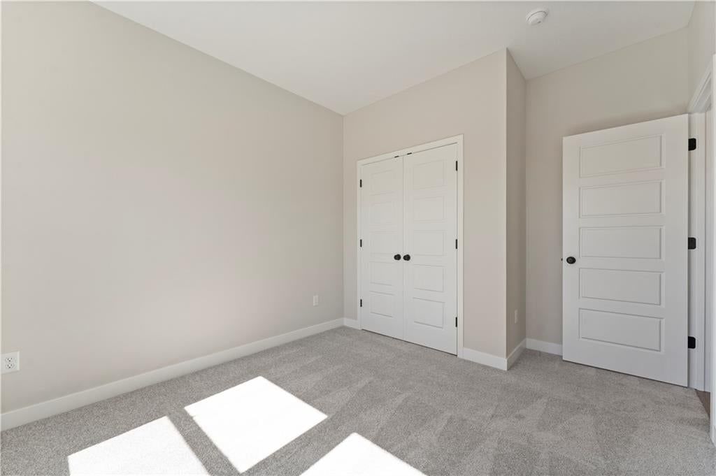 Photo 14 of 19 - 1525 Portsmouth Lane, Raymore, MO 64083