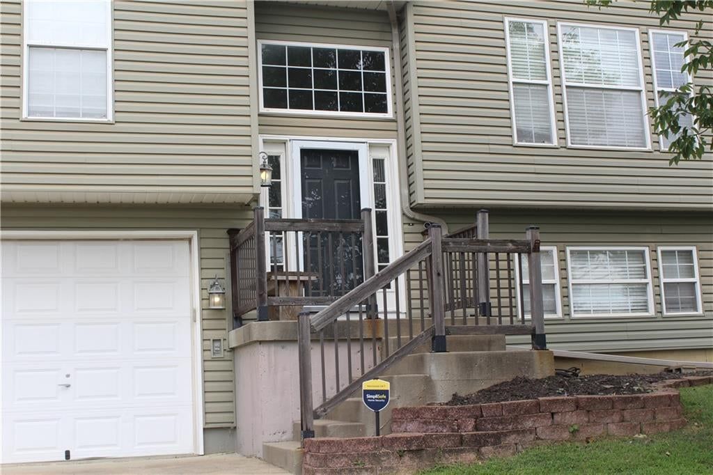 Covered front porch at 212 E Whispering Hills Boulevard, Lone Jack, MO 64070