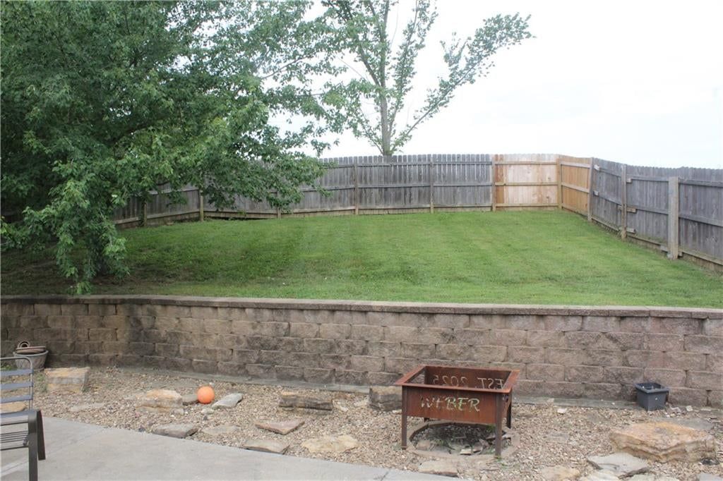 Concrete patio at 212 E Whispering Hills Boulevard, Lone Jack, MO 64070