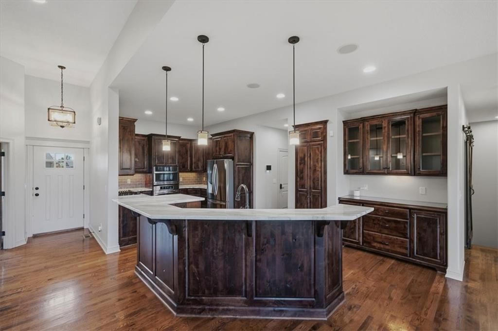 Kitchen island, statement lighting and recessed lighting at 22702 E 41st Terrace, Independence, MO 64015