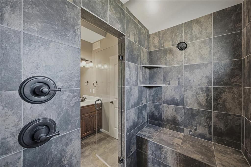 Walk-in shower, tiled shower and frameless glass shower at 22702 E 41st Terrace, Independence, MO 64015