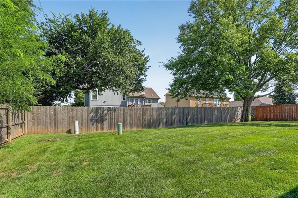 Fenced yard at 1116 Granada Drive, Raymore, MO 64083