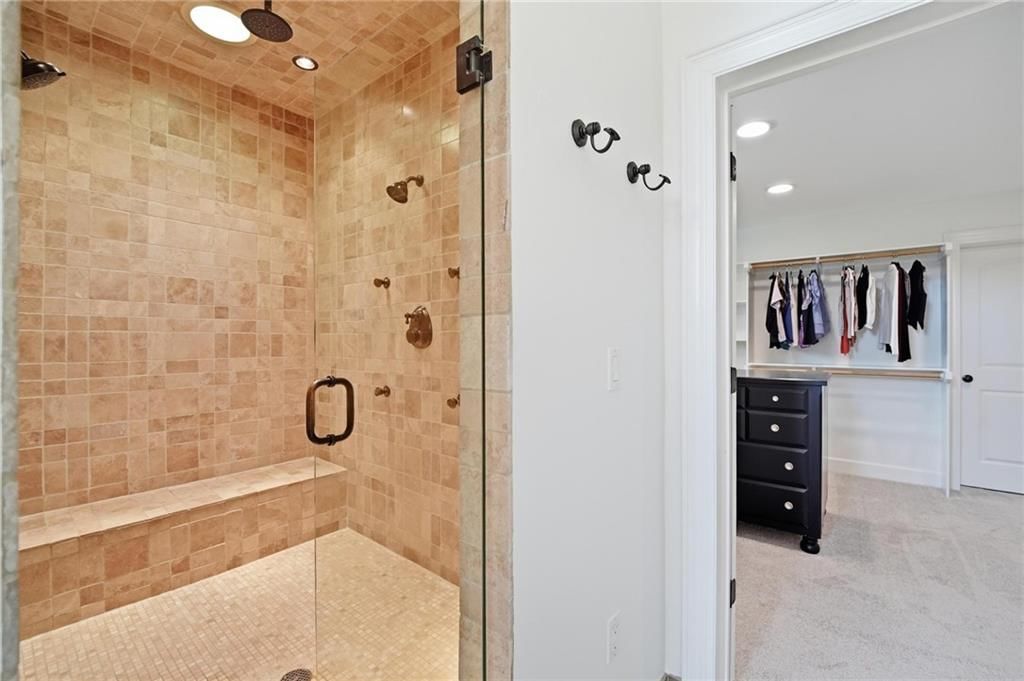 Walk-in shower, tiled shower and frameless glass shower at 16199 Overbrook Lane, Stilwell, KS 66085
