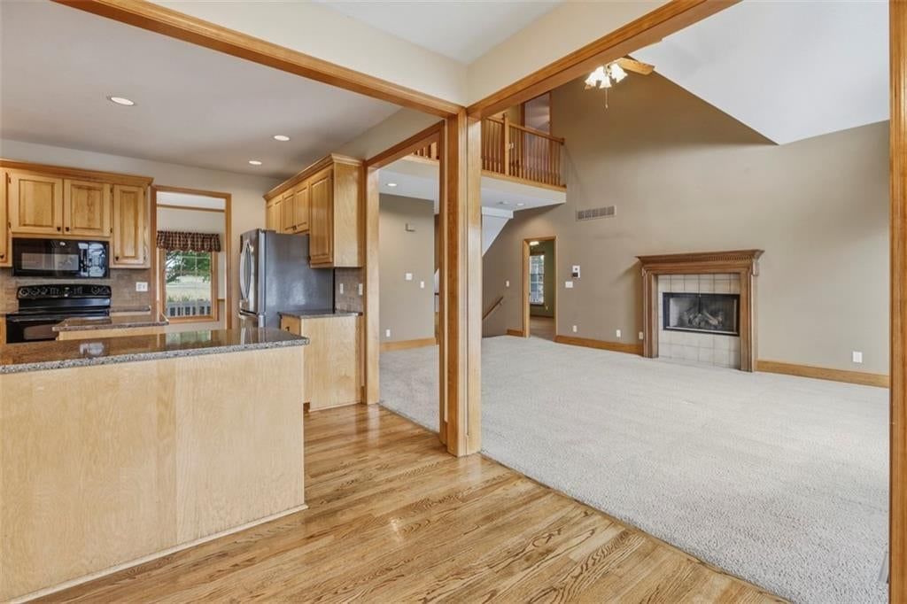 Kitchen island, granite counters and double oven at 3930 W 223 Street, Bucyrus, KS 66013
