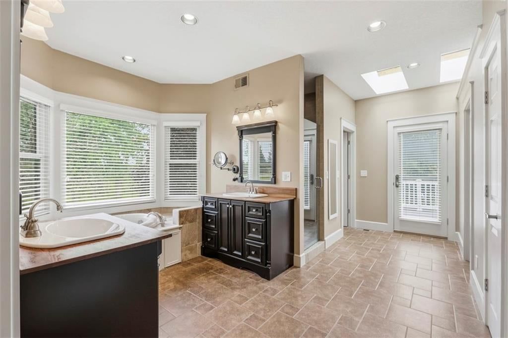 Walk-in shower, tiled shower and frameless glass shower at 3930 W 223 Street, Bucyrus, KS 66013