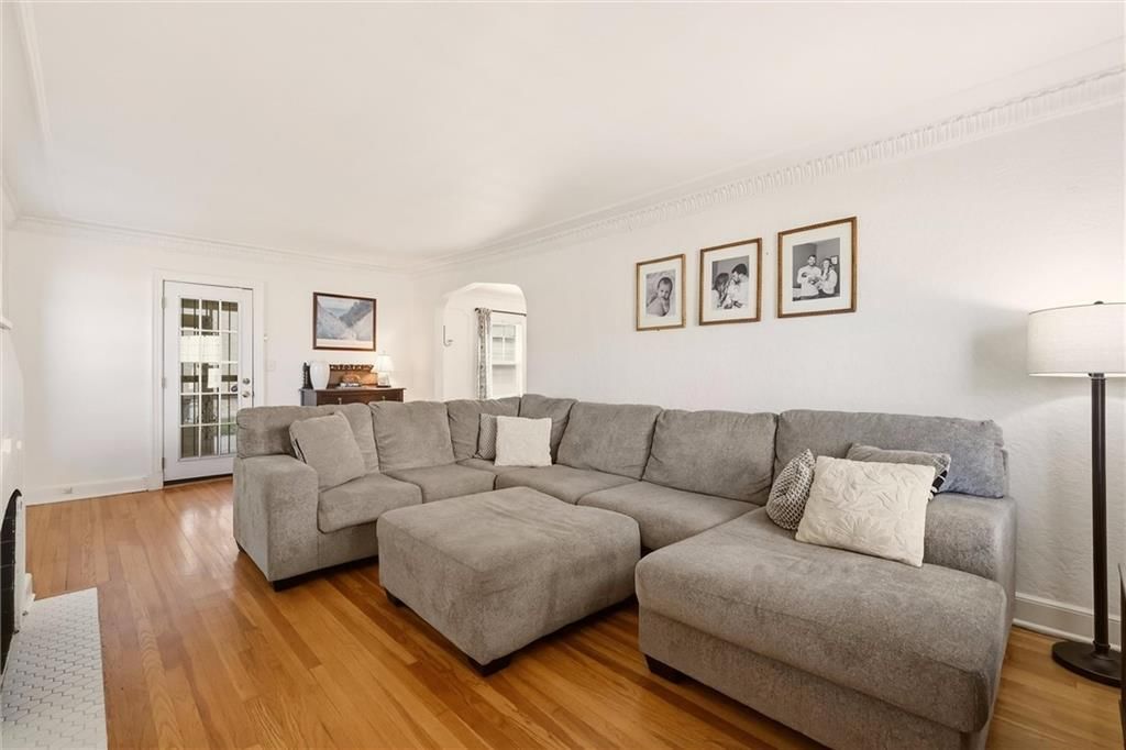 Hardwood floors, wall of windows and white trim at 405 E Gregory Boulevard, Kansas City, MO 64131