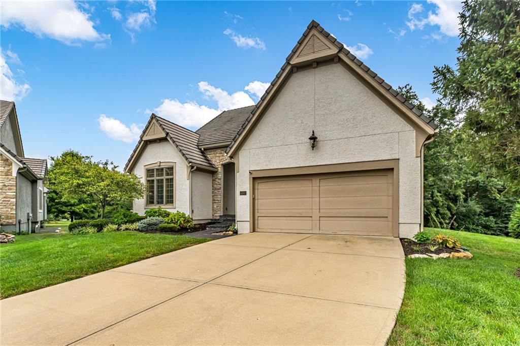 Stucco exterior and attached garage at 5303 W 124th Court, Overland Park, KS 66209