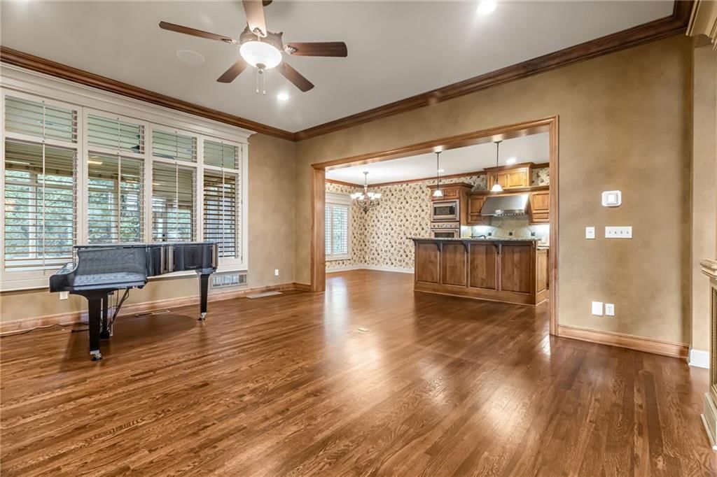 Tall ceilings, fireplace and hardwood floors at 5303 W 124th Court, Overland Park, KS 66209