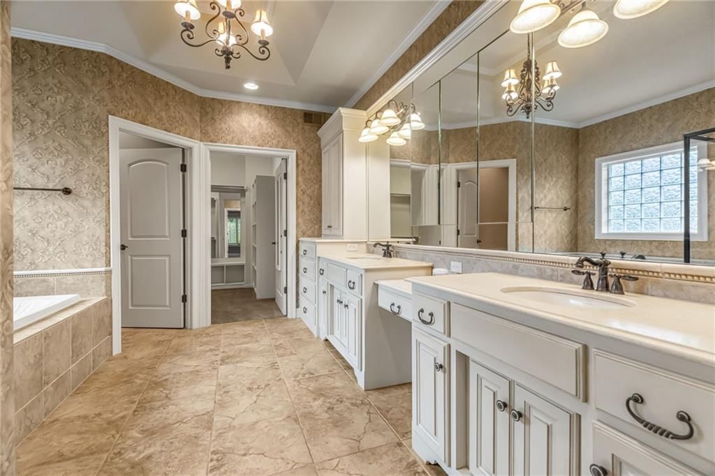 Freestanding tub, double vanity and black hardware at 5303 W 124th Court, Overland Park, KS 66209
