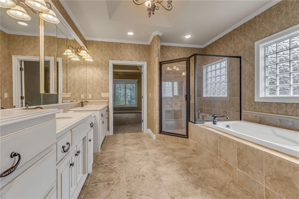 Tiled shower and frameless glass shower at 5303 W 124th Court, Overland Park, KS 66209