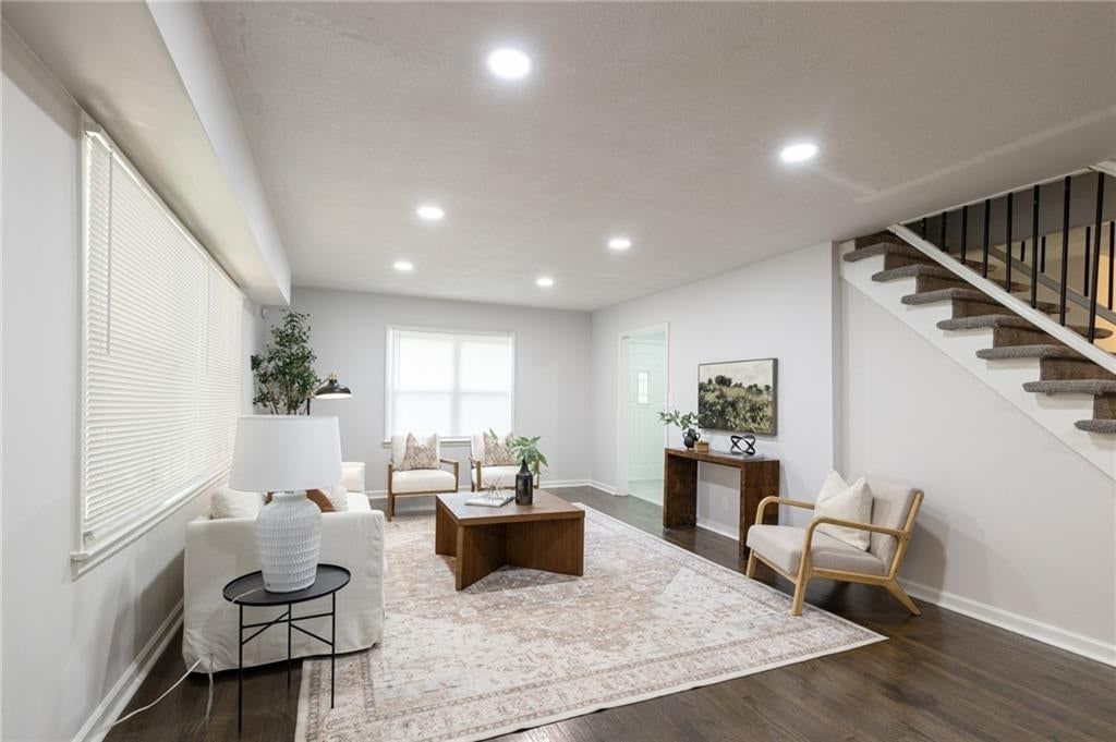 Tall ceilings, open floor plan and hardwood floors at 319 E Bellevista Drive, Independence, MO 64055