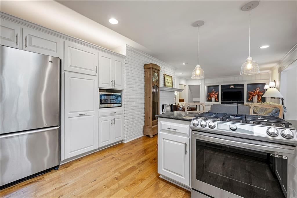Photo 9: white kitchen cabinets, 9828 Sagamore Road, Leawood, KS 66206