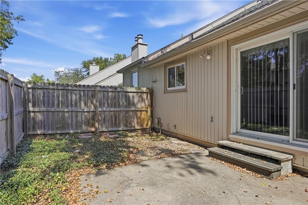 Deck, fenced yard and mature trees at 5970 N Bellefontaine Avenue, Gladstone, MO 64119