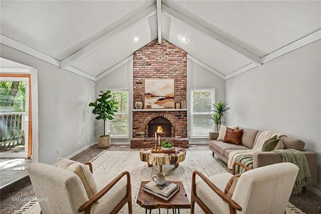 Tall ceilings, fireplace and exposed brick wall at 9038 Manning Avenue, Kansas City, MO 64138