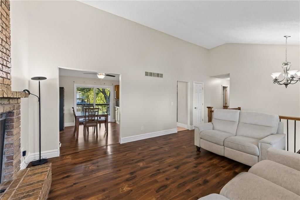 Open floor plan, hardwood floors and chandelier at 8005 N Congress Avenue, Kansas City, MO 64152