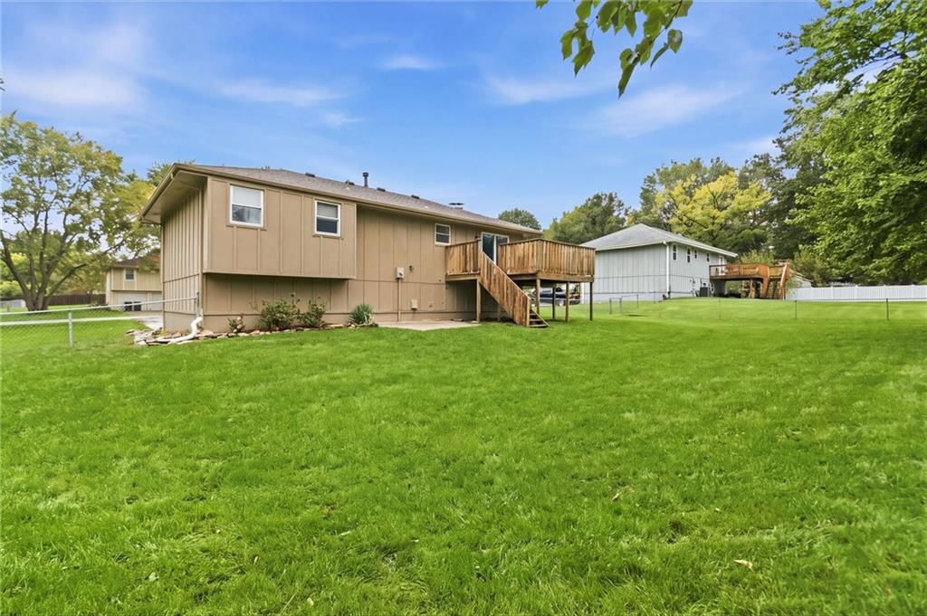 Big backyard, fenced yard and mature trees at 10517 N McGee Street, Kansas City, MO 64155