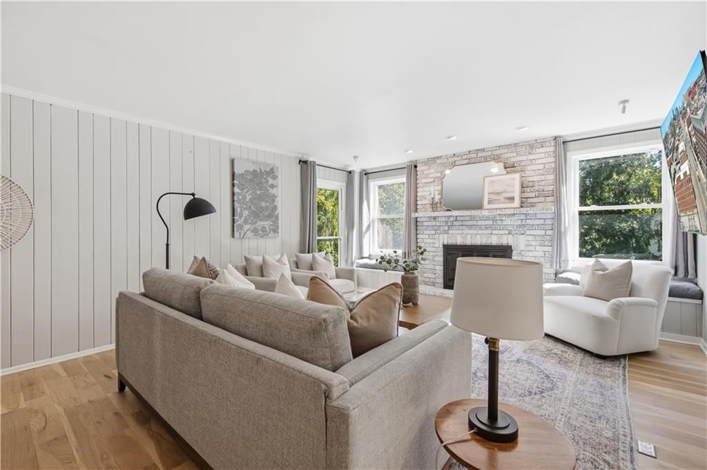 Fireplace, shiplap / paneling and wall of windows at 13203 W 76th Street, Lenexa, KS 66216