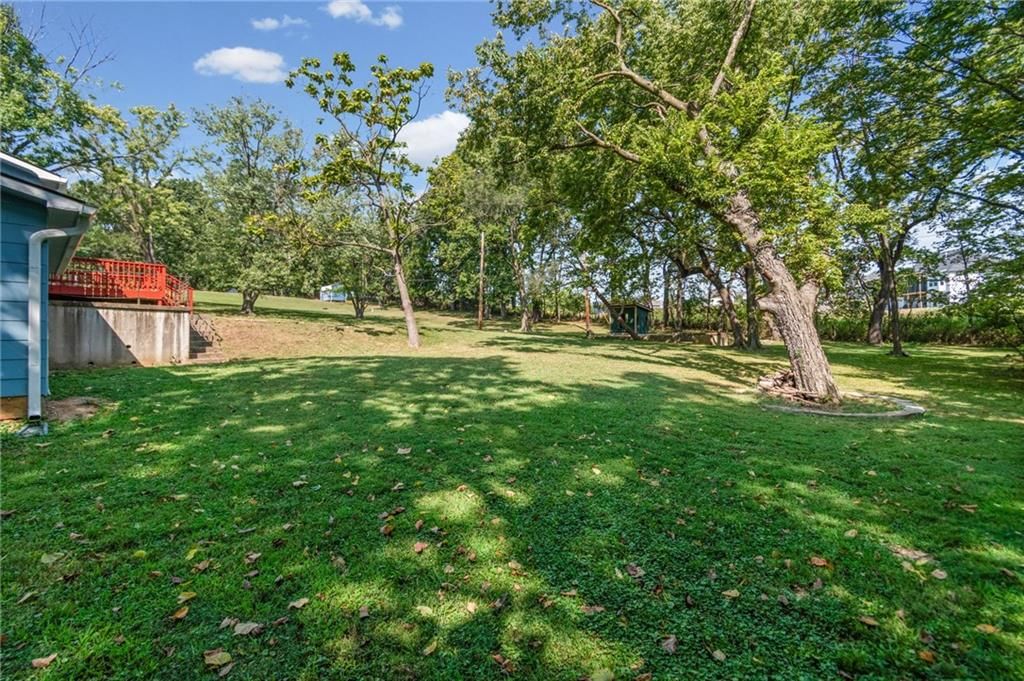 Big backyard and mature trees at 4516 NW Gleason Road, Kansas City, MO 64151