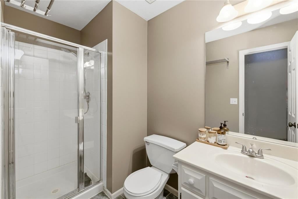 Walk-in shower and tiled shower at 1404 Cedar Ridge Circle, Raymore, MO 64083