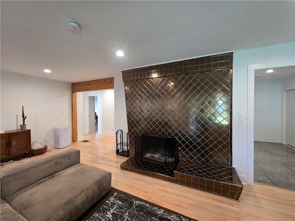 Fireplace, shiplap / paneling and tile fireplace at 7142 FOREST Avenue, Kansas City, MO 64131