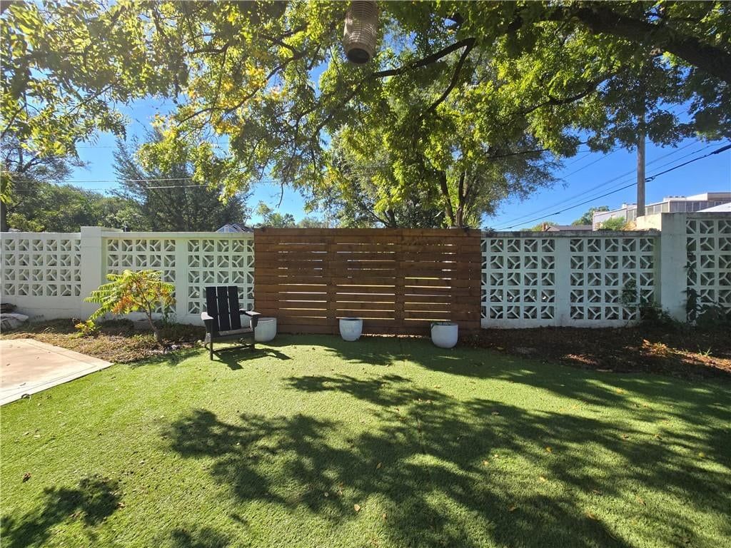 Big backyard, fenced yard and covered patio at 7142 FOREST Avenue, Kansas City, MO 64131