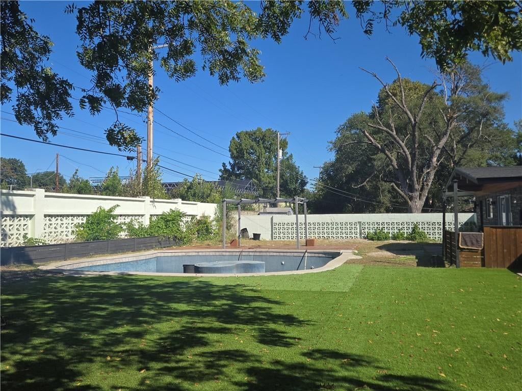In-ground pool and pool fence at 7142 FOREST Avenue, Kansas City, MO 64131