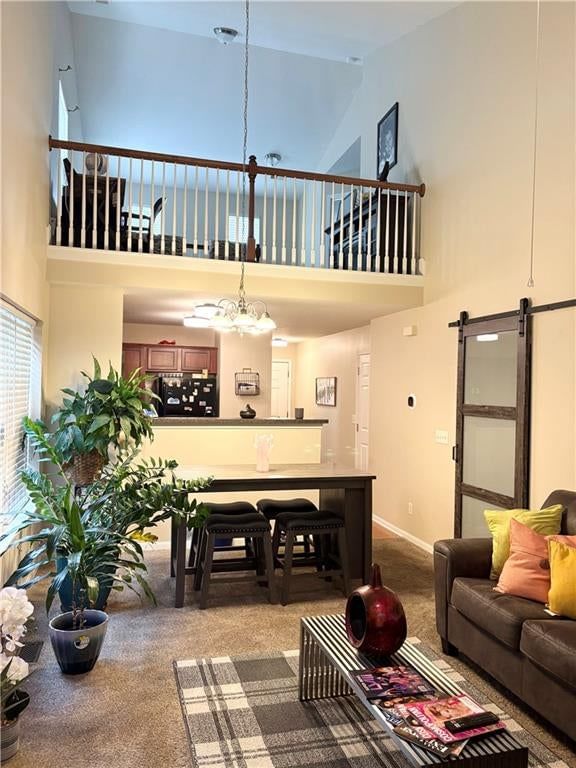 Tall ceilings, open floor plan and statement lighting at 3628 NW 84th Terrace, Kansas City, MO 64154