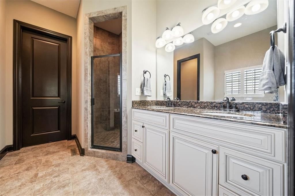 Black hardware, double vanity and white vanity at 3111 N 118TH Terrace, Kansas City, KS 66109