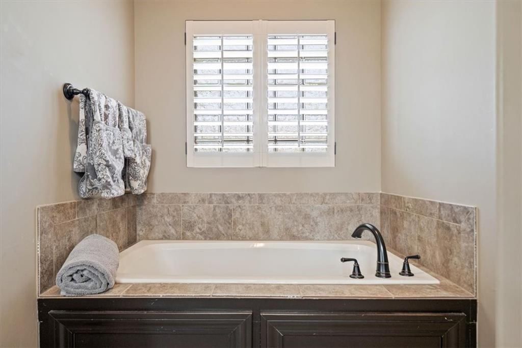 Frameless glass shower, tiled shower and walk-in shower at 3111 N 118TH Terrace, Kansas City, KS 66109