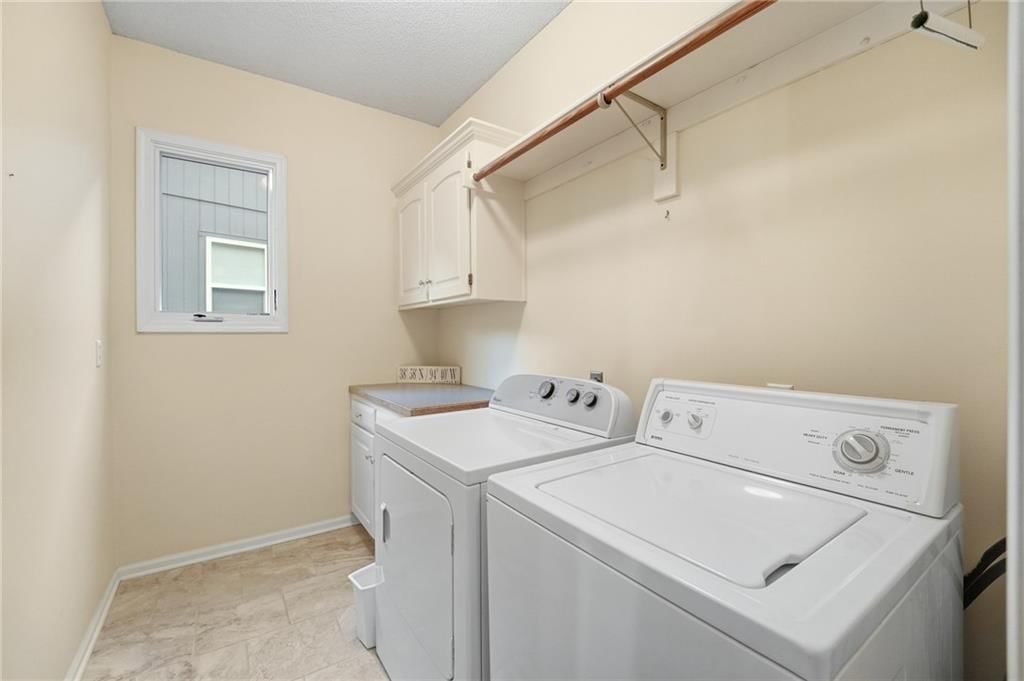 Main-floor primary bedroom, tray ceiling and bedroom sitting area at 12610 W 126th Street, Overland Park, KS 66213